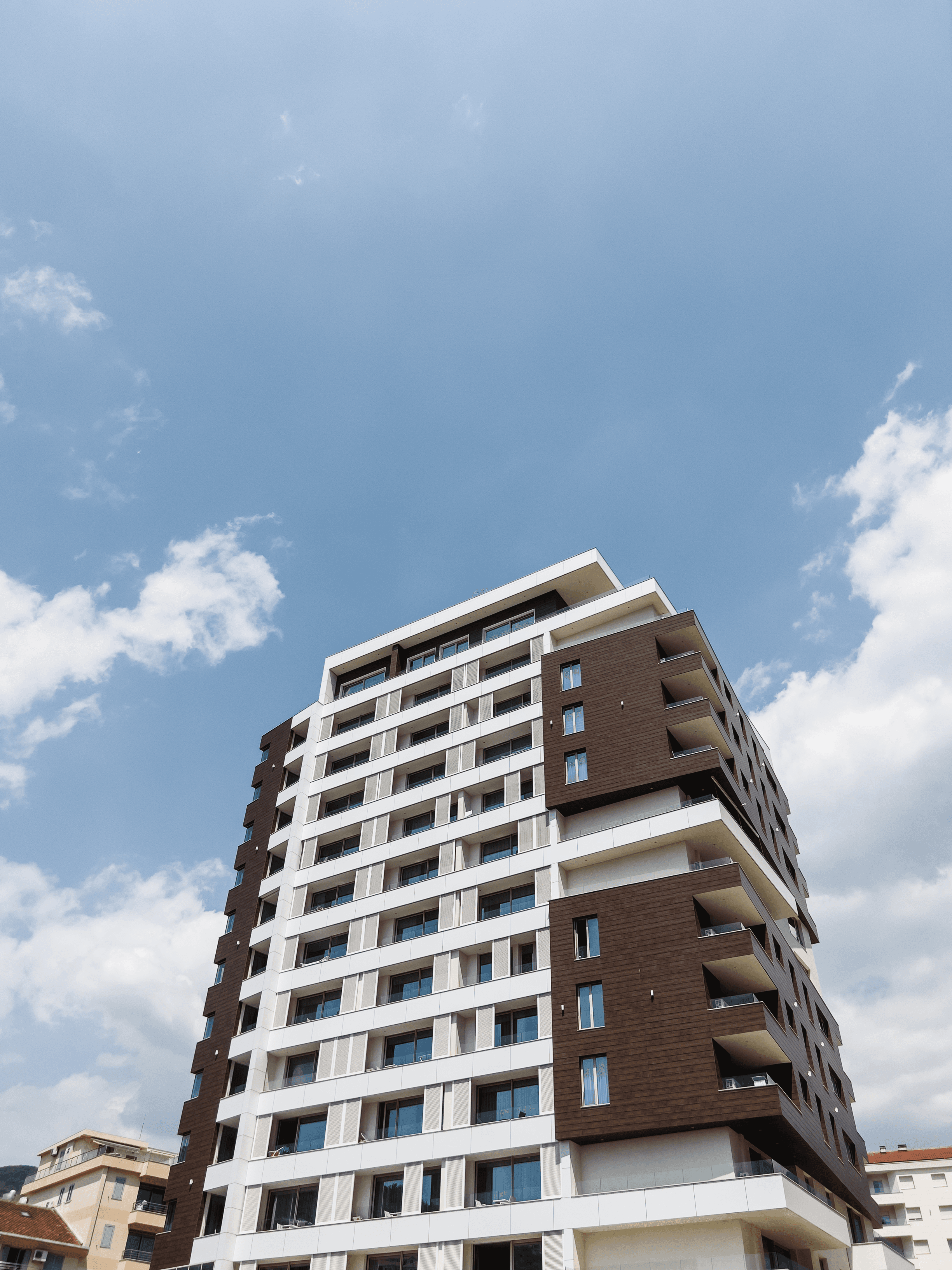 Modern apartment building against a blue sky